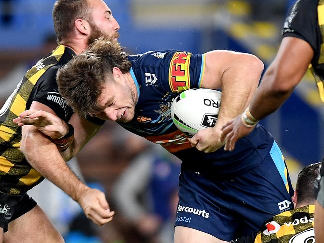 GOLD COAST, AUSTRALIA - JULY 10: Jai Arrow of the Titans takes on the defence during the round nine NRL match between the Gold Coast Titans and the New Zealand Warriors at Cbus Super Stadium on July 10, 2020 in Gold Coast, Australia. (Photo by Bradley Kanaris/Getty Images)