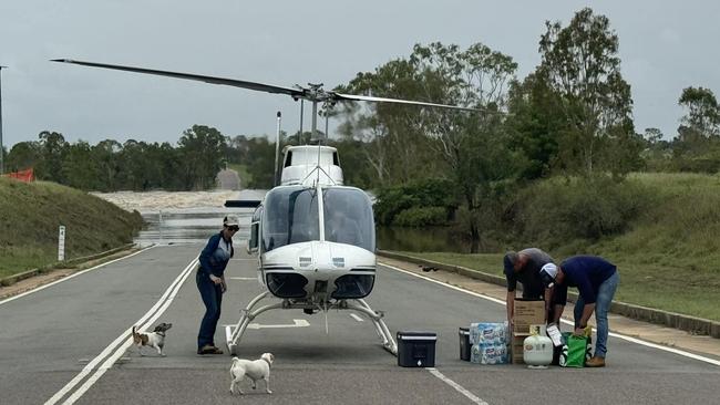 Food, water and medical supplies were dropped to the truck drivers and campers stranded at Fletchers Creek. Picture: NQ Freighters