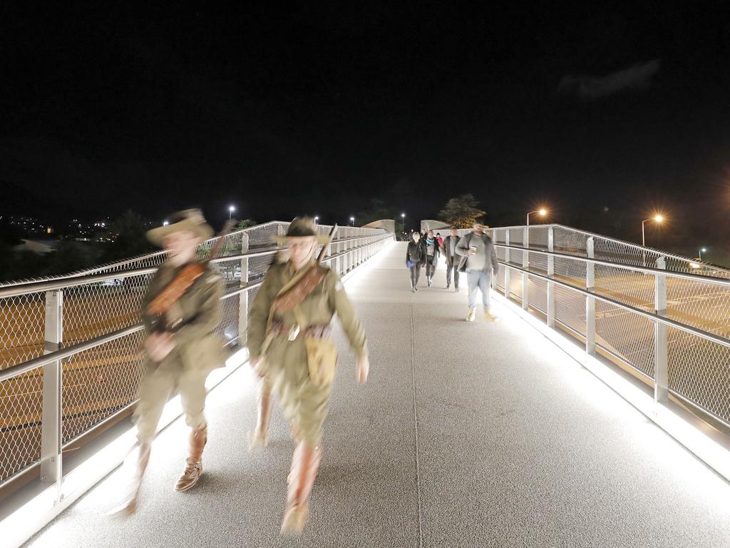 People cross Hobart's new Bridge of Remembrance on their way to the Anzac Day dawn service in Hobart. Picture: PATRICK GEE