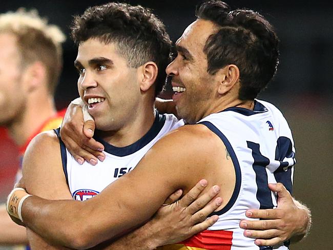 GOLD COAST, AUSTRALIA - JULY 13: Tyson Stengle of the Crows celebrates his goal with team mate Eddie Betts during the round 17 AFL match between the Gold Coast Suns and the Adelaide Crows at Metricon Stadium on July 13, 2019 in Gold Coast, Australia. (Photo by Jono Searle/AFL Photos via Getty Images)