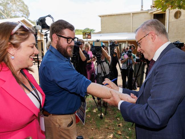 Prime Minister Anthony Albanese writes and signs Ã¢â¬ËNo Change To WA GSTÃ¢â¬â¢ on the forearm of Dylan Caporn, State Political reporter for The West Australian before signing a copy of The West Australian newspaper with the headline Ã¢â¬ËÃ¢â¬â¢Take GST VowÃ¢â¬â¢ during a press conference at Thornlie TAFE in Perth, Monday, February 19, 2024. (AAP Image/Richard Wainwright) NO ARCHIVING