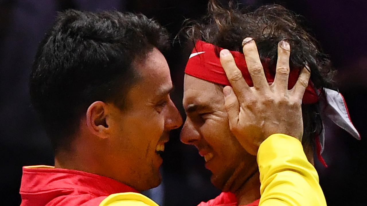 Rafael Nadal celebrates with Spain's Roberto Bautista Agut.