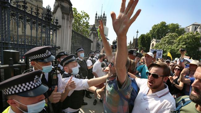 Protesters in London march against restrictions, including the Covid passport. (Photo by Martin Pope/Getty Images)