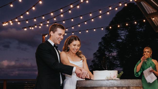 Emma Brown and Isaac Bongaarts cut their cake. Pictures: Say Milk