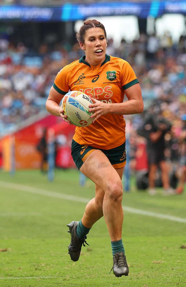 SYDNEY, AUSTRALIA - JANUARY 29: Charlotte Caslick of Australia runs with the ball before scoring a try during the 2023 Sydney Sevens match between Australia and Fiji at Allianz Stadium on January 29, 2023 in Sydney, Australia. (Photo by Mark Metcalfe/Getty Images)