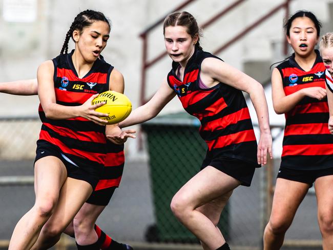 Action from the STJFL Under-15 Girls A2 grand final between Lauderdale Red and New Norfolk. Picture: Linda Higginson