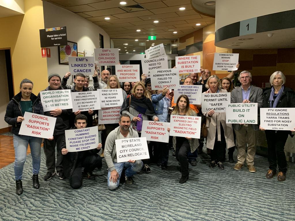 More than 30 people attended the council meeting with placards.