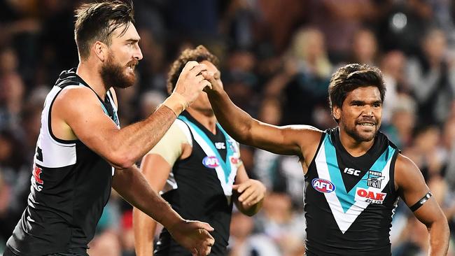 Jake Neade of Port Adelaide celebrates a goal with Charlie Dixon.