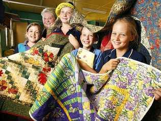 Preparing for the Boonah Girl Guides Quilt and Craft show from March 9-11 are (from left) Rhiannon Smith, district leader Beth Hern, Mikayla Schulz, Georgia Schulz and Emily Matthews. . Picture: Rob Williams