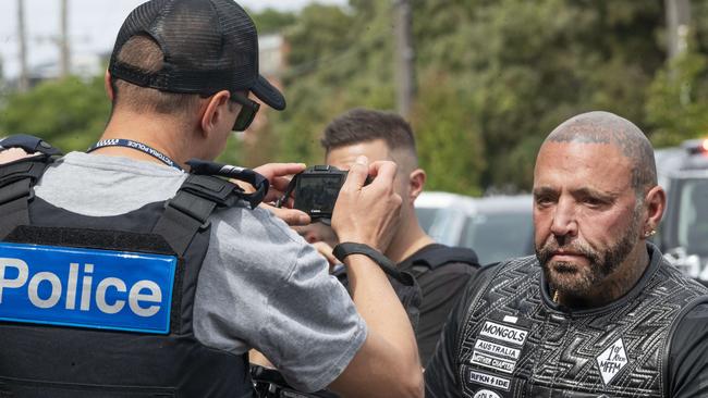 Toby Mitchell getting photographed by police at a checkpoint. Picture: Rob Leeson