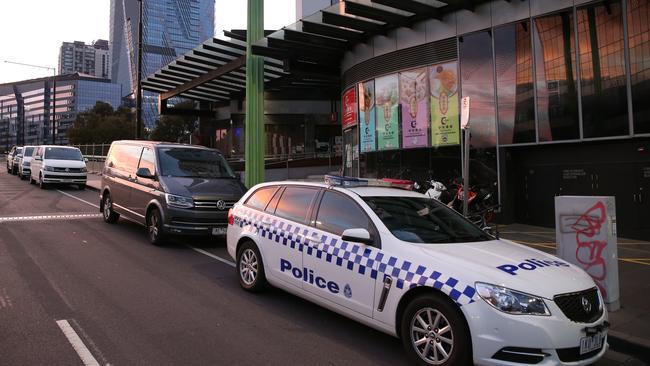 Police outside the apartment building. Picture: David Crosling