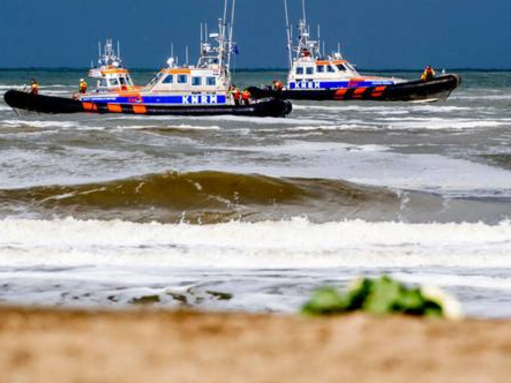 The coastguard, police and fire brigade looking for missing surfers lost at sea off the coast of Scheveningen, The Hague.