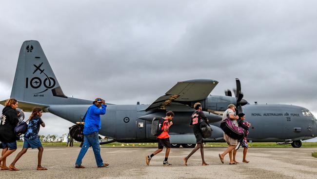 The Royal Australian Air Force assists residents from the Kalkarindji area being evacuated during major flooding in the Northern Territory.