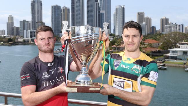 Colleges and Surfers captains Troy Hobbs and Andy Finn with the premiership trophy pre-match. Picture: Glenn Hampson