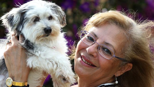 Marielle with Charlie. Dog Charlie was lost for seven years. She was found in St Helens Park on Sunday by resident Jess Cameron and has been reunited with overjoyed owner Marielle Savannah.