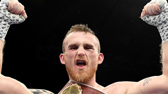 BRISBANE, AUSTRALIA - DECEMBER 15: Dennis Hogan celebrates victory after the junior-middleweight bout between Dennis Hogan and Jamie Weetch at Brisbane Convention &amp; Exhibition Centre on December 15, 2018 in Brisbane, Australia. (Photo by Bradley Kanaris/Getty Images)