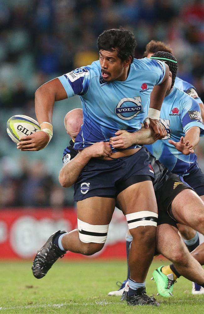 Will Skelton offloads in the tackle against the Hurricanes at Allianz Stadium.
