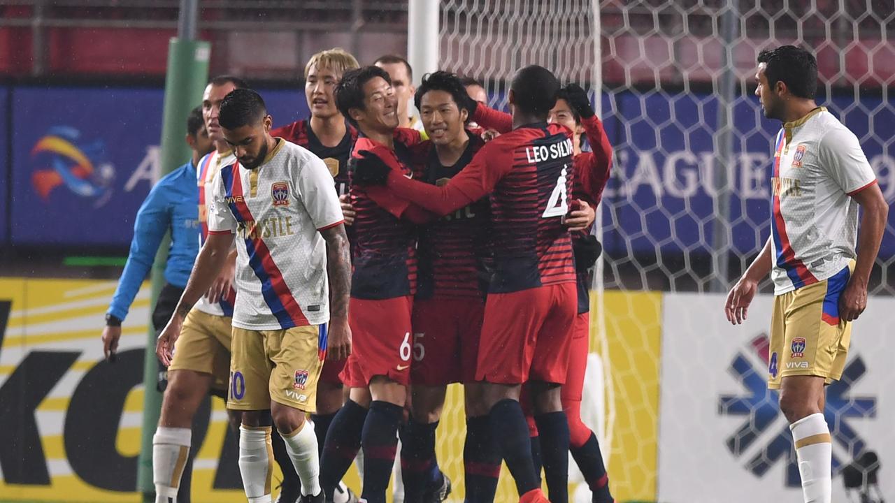 Japan's Kashima Antlers forward Sho Ito (C-facing camera) celebrates after scoring a goal with teammates