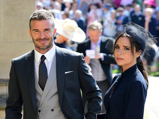 David and Victoria Beckham — pictured at Meghan and Harry’s wedding — are being tipped as possible godparents to the royal boy. 