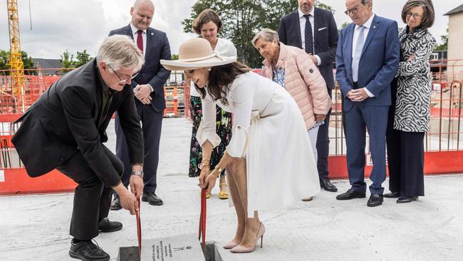 Crown Princess Mary of Denmark and project manager Michael Hyllegaard lay the foundation stone. Picture: AFP