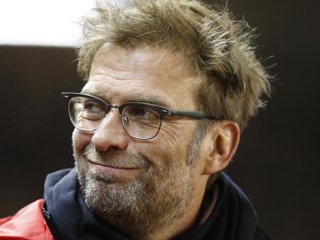 Liverpool's manager Juergen Klopp smiles before the English Premier League soccer match between Liverpool and Manchester City at Anfield Stadium, Liverpool, England, Wednesday, March 2, 2016. (AP Photo/Jon Super)