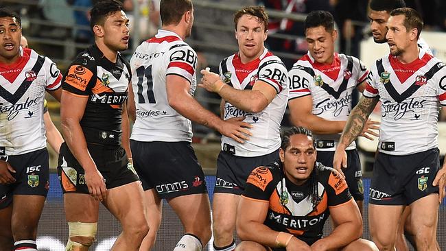 The Roosters celebrate Daniel Tupou’s first half try.