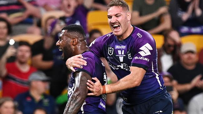 BRISBANE, AUSTRALIA – OCTOBER 16: Suliasi Vunivalu and Brenko Lee of the Storm celebrate Dale Finucane of the Storm scoring a try during the NRL Preliminary Final match between the Melbourne Storm and the Canberra Raiders at Suncorp Stadium on October 16, 2020 in Brisbane, Australia. (Photo by Bradley Kanaris/Getty Images)