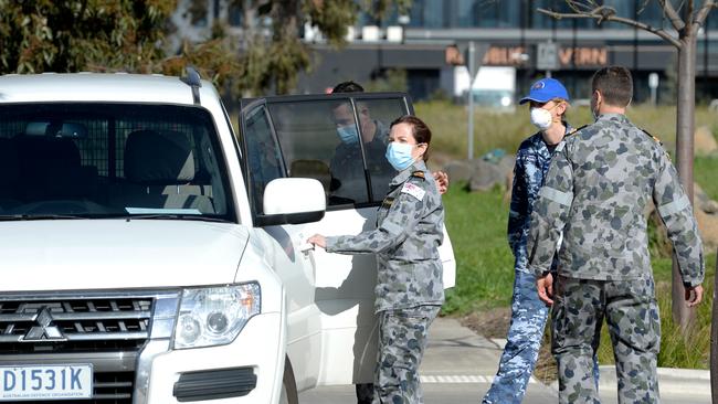 ADF personnel arrive at Epping Gardens Aged Care. Picture: Andrew Henshaw