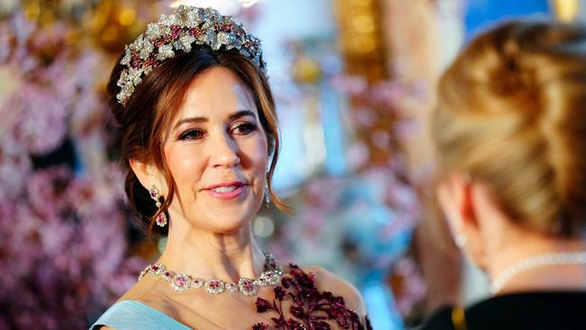 Queen Mary of Denmark welcomes a guest for a banquet at Stockholm Palace in Stockholm, Sweden on May 6, 2024, to celebrate the Danish royal couple's two-day state visit to the country. (Photo by Ida Marie Odgaard / Ritzau Scanpix / AFP) / Denmark OUT