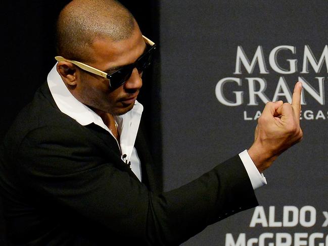 RIO DE JANEIRO, BRAZIL - MARCH 20: (EDITORS NOTE: Image contains an obscene gesture.) Jose Aldo of Brazil gestures for Conor Mcgregor of Ireland at the UFC 189 World Media Tour Launch press conference, at Maracanazinho on March 20, 2015 in Rio de Janeiro, Brazil. (Photo by Alexandre Loureiro/Zuffa LLC/Zuffa LLC via Getty Images)