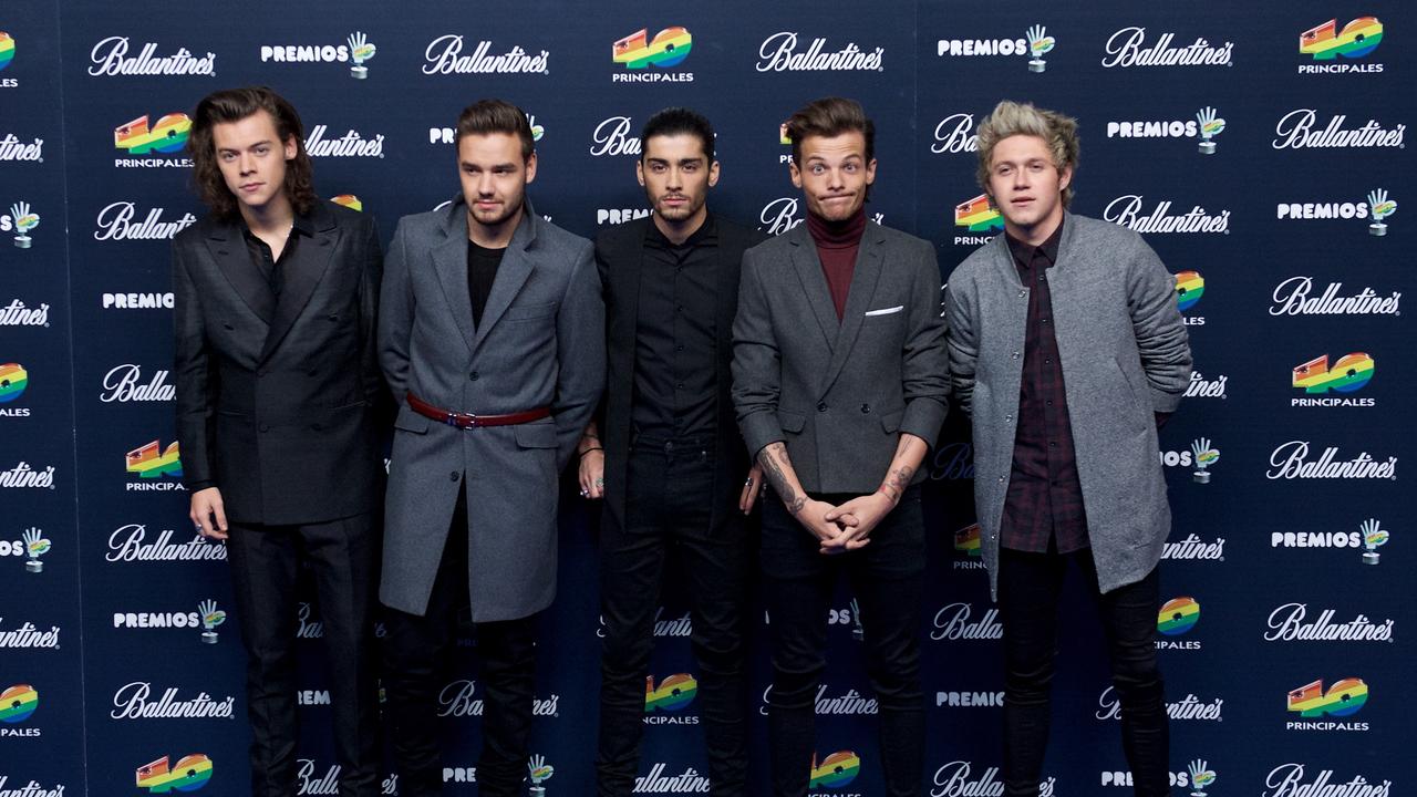 Harry Styles, Liam Payne, Zayn Malik, Louis Tomlinson and Niall Horan of One Direction posing together in 2014. Photo: Carlos Alvarez/Getty Images.