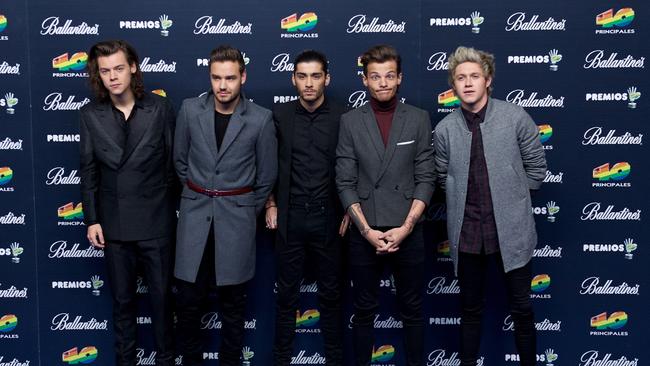 Harry Styles, Liam Payne, Zayn Malik, Louis Tomlinson and Niall Horan of One Direction posing together in 2014. Photo: Carlos Alvarez/Getty Images.