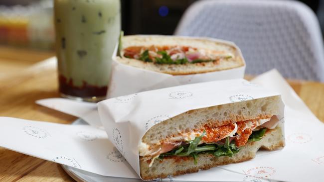 Happy Larry’s delicious prosciutto sandwich includes two slabs of fluffy focaccia stuffed with paper-thin prosciutto, vibrant rocket, chunky red capsicum sauce and a creamy burrata. Picture: Nikki Davis-Jones