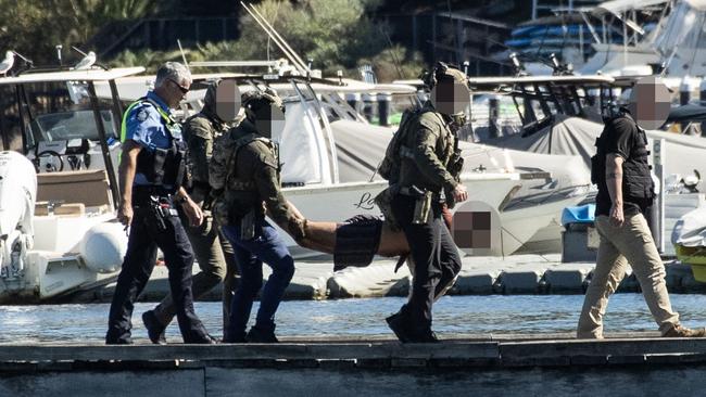 A man was arrested after he drove his red Jeep Wrangler off the Claremont Jetty during a police stand off near Perth. Picture: Michael Wilson/ The West Australian/ NewsWire