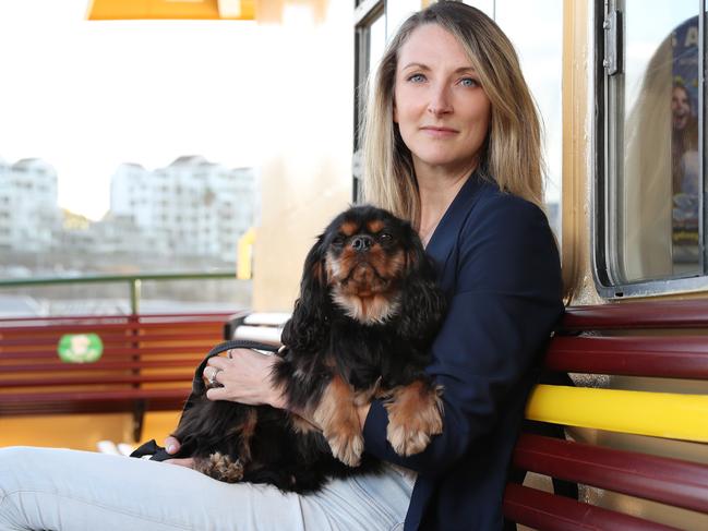 Pictured on a Sydney ferry near her home in Neutral Bay is Stef McLaughlin and her dog Lukas, 2. Picture: Richard Dobson