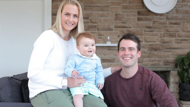 BYLINE: LUKE BOWDEN: Tasmanian cricketer, Alex Doolan with wife, Laura and 8 month old son Wilbur.