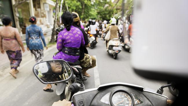 Tourists are reminded to wear helmets on hired scooters. Picture: iStock