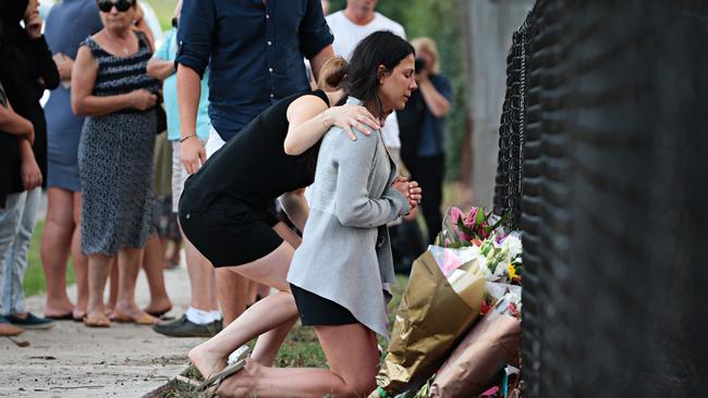 Leila Geagea prays for her children on Sunday. Picture: Adam Yip