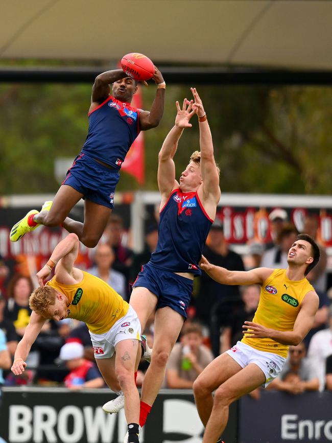 Kysaiah Pickett flying high above the pack in the Dees’ opening pre-season game. Picture: Morgan Hancock/Getty Images.