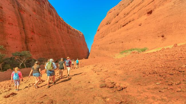 People walking in Uluru-Kata Tjuta National Park. Outback Red Centre. Picture: iStock