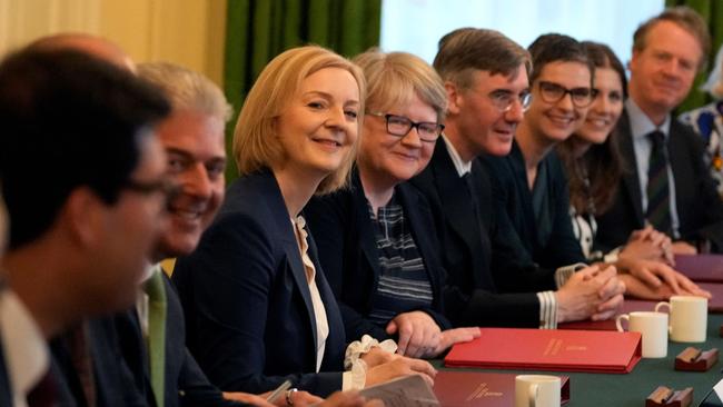 Liz Truss sits alongside Britain's Health Secretary and deputy Prime Minister Therese Coffey as she poses with members of her new cabinet in September. Pucture: Pool / AFP