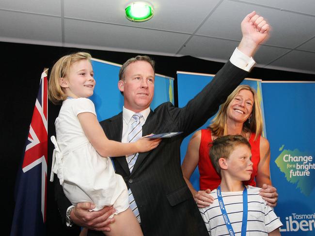 Will Hodgman holds his daughter Lily and is joined by his son James and his wife Nicola Hodgman after his address to the party faithful at the Liberals Campaign Launch in Launceston yesterday.