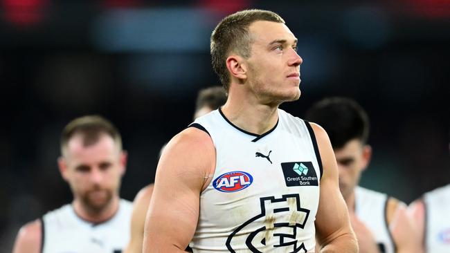 Patrick Cripps leads Carlton off after another loss.