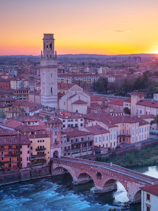 Aerial cityscape image of Verona, Italy at sunset.