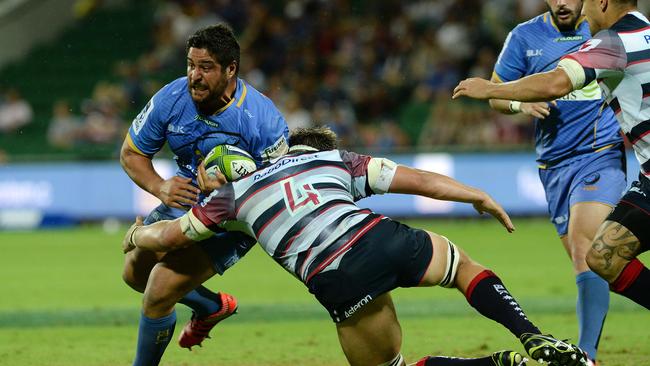 Force prop Pek Cowan is tackled by Rebels lock Luke Jones during a game in Perth.