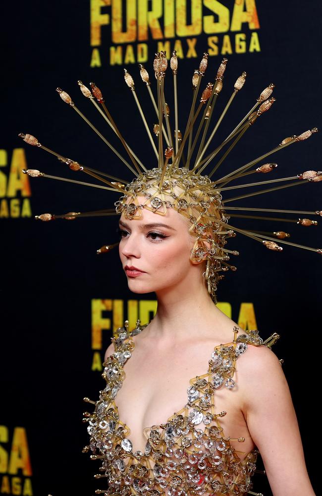 Taylor-Joy turned heads in an eye-catching gown that she paired with an outlandish head piece showing off her signature quirky style. Photo by Brendon Thorne/Getty Images.