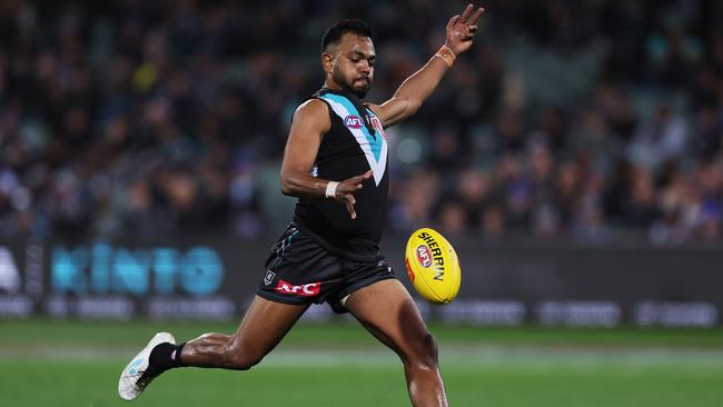 ADELAIDE, AUSTRALIA - JULY 08: Junior Rioli of the Power kicks a goal during the 2023 AFL Round 17 match between the Port Adelaide Power and the Gold Coast Suns at Adelaide Oval on July 8, 2023 in Adelaide, Australia. (Photo by James Elsby/AFL Photos via Getty Images)