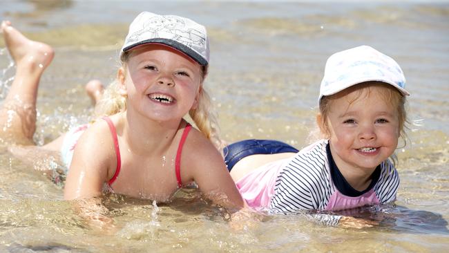 Amelia, 6, and Evelyn, 3, make the most of Wednesday’s good weather. Picture: Sarah Matray