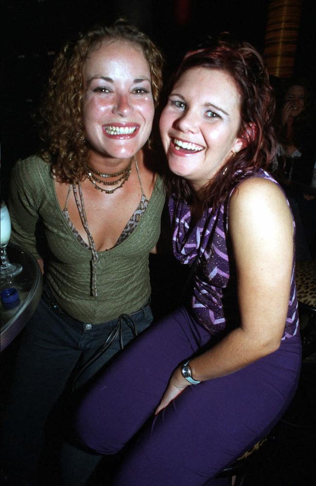 Natalie Scott and Kay Eastaway share some laughs at the Rolling Rock nightclub in June 2003. Picture: Sharyn Rosewarne