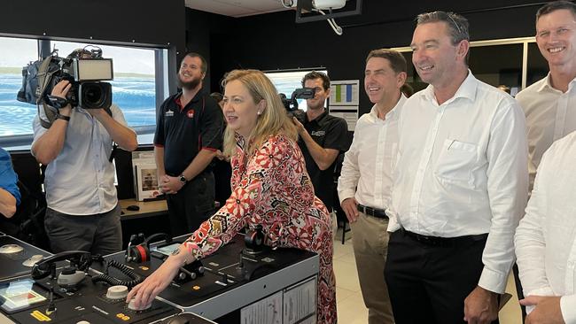 Premier Annastacia Palaszczuk pilots a ship out of the Trinity Inlet in the facility's simulator. Photo: Dylan Nicholson